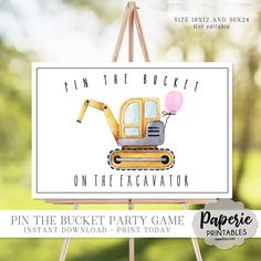 an easel with a sign that says pin the bucket on the excavator