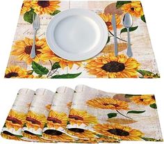 the placemats have sunflowers on them and are ready to be eaten