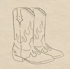 a drawing of a pair of cowboy boots with flames on the soles and back