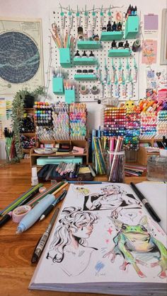 an art studio with various colored pencils and markers on the table next to it