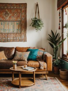 a living room with leather couches and potted plants on the wall above them