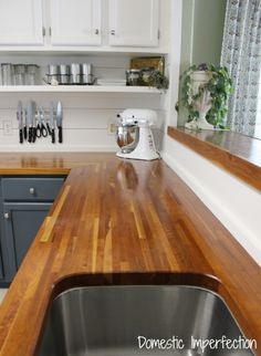 a kitchen counter top with a mixer on it