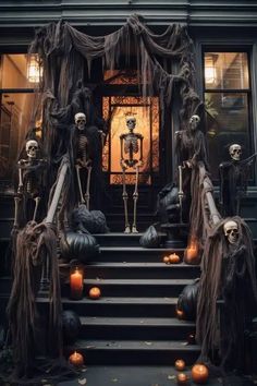 halloween decorations with skeletons and pumpkins on the steps