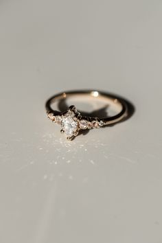 a diamond ring sitting on top of a table