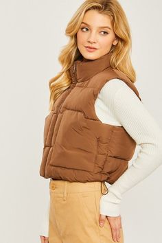 Stay warm in style with this puffer vest with pockets. Keep your essentials close with the two side pockets, perfect for storing phones, wallets, and other items. Wears lightweight but provides ultimate warmth, making it ideal for any outdoor adventure. Fabric & fit: Model is wearing size Small. Puff Vest, Vest With Pockets, Cropped Zip Up, Stylish Wardrobe, China Style, Reversible Vest, Cropped Vest, Judy Blue Jeans, Down Vest