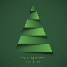 a green christmas tree with the words merry christmas and happy new year