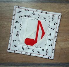 a close up of a piece of cloth with musical notes on it