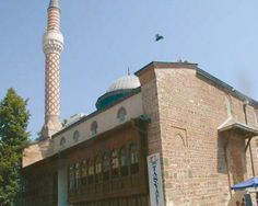 an old building with a tall tower in the background