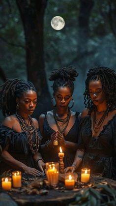 three women standing around a table with candles in front of them and the moon behind them