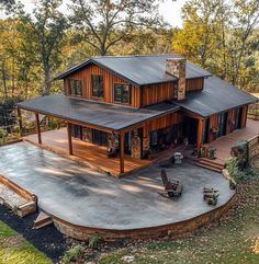 an aerial view of a house in the woods