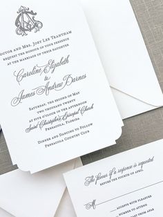 the wedding stationery is laid out on top of each other