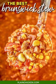 a spoon full of chili and corn soup