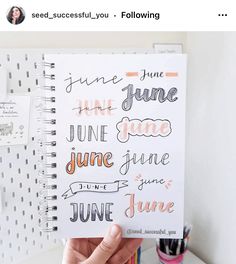 someone is holding up a spiral notebook with some writing on it and the words june are written in different font styles