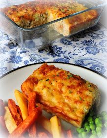 there is a casserole and some vegetables on the plate next to each other