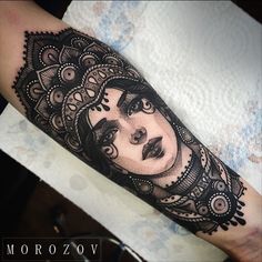 a woman's face on the arm with black and white ink, done by morozov