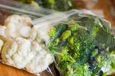 broccoli and cauliflower are wrapped in plastic