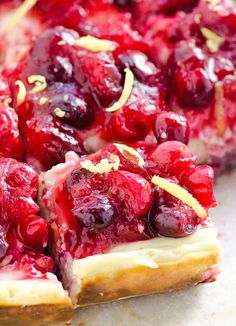 a close up of a pie with cherries on it