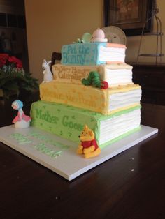 a winnie the pooh birthday cake on top of a table