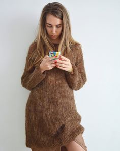 Hello, I'm the one, who won't let you down - brown mohair tunic dress with a little bit of mustard shadow. I will comfort you, keep you warm and will make you smile. I'm 100% hand made and proud of that. I consist of 70% italian kid mohair and 30% of nylon, which makes me incredibly natural. I'm quite unique as could be worn all year long. I'm in one size and one size fits all because my measurements are : ❤️ Width -50 cm ❤️ Lengths -86 cm If you would like me in other size, you could request a Cozy Brown Sweater Dress For Winter, Cozy Brown Winter Sweater Dress, Cozy Brown Mohair Sweater, Long Oversized Sweater, Knitted Tunic, Hand Knitted Dress, Mohair Knit, Off Shoulder Sweater, Mohair Sweater