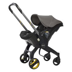 the stroller is black and green with yellow wheels