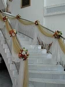 the stairs are decorated with flowers and ribbons