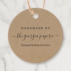 handmade by the gargania paperie gift tag on a marble table top