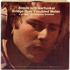 a close up of a person wearing headphones on top of a magazine cover with the title simon and garfunkel bridge over troubled water