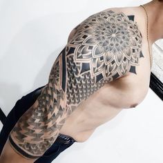 a man with a tattoo on his arm