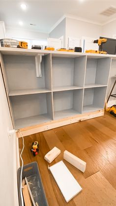 the shelves are being built with construction tools