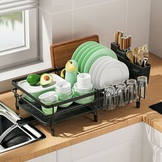 the dish rack is full of dishes and utensils