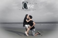 a man and woman kissing on the beach with an overcast sky in the background