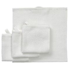 three white towels folded on top of each other