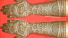 two hands with henna tattoos on them, one is showing the intricate pattern and the other has an ornate design