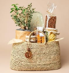 a wicker basket filled with assorted items and a potted plant in it