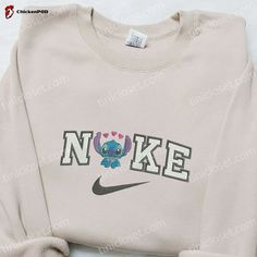 Introducing the Stitch Hearts x Nike Embroidered Sweatshirt, a perfect blend of style and comfort. Crafted with meticulous attention to detail, this sweatshirt features intricate embroidery of beloved Disney characters, adding a touch of whimsy to your wardrobe. Designed with a cozy hood, this Disney Characters Embroidered Hoodie envelops you in warmth on chilly winter [...] Nike Cartoon, Nike Inspired, Best Family Gifts, Maroon Hoodie, Shirt Nike, Hoodie Material, Custom Nikes, Nike Sweatshirts, Embroidered Clothes