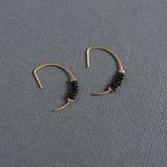 Artist earrings -matte black – Wild Roots Creative Modern Matte Black Jewelry For Gifts, Modern Matte Black Jewelry As Gift, Modern Matte Black Jewelry As A Gift, Modern Black Hoop Jewelry, Modern Black Small Hoop Jewelry, Modern Black Single Earring, Minimalist Black Metal Jewelry, Modern Black Hoop Earrings As Gift, Modern Black Hoop Earrings For Gift