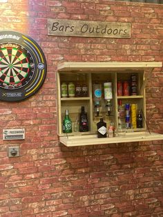 a brick wall with shelves and darts on it