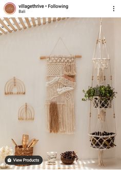 there is a wall hanging on the wall next to some baskets and other things in front of it