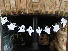 a fireplace with ghost buntings hanging from it