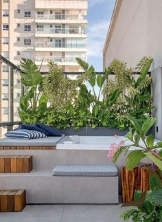 an outdoor hot tub with plants on it