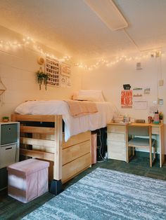 a bedroom with a bed and desk in it