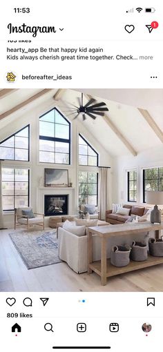 a living room filled with furniture and a fire place in the middle of an open floor plan