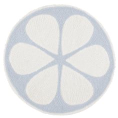 a blue and white circular rug with four petals