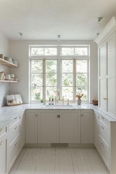 a white kitchen with lots of counter space