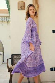 The Jade Printed Maxi Dress in Lavender is a must-have for any beach-to-bar occasion. Its sophisticated and graceful design sets it apart from other maxi dresses, making it an instant classic from Blue Boheme. Made from 100% Indian cotton with a lining, this dress is both comfortable and stylish. It comes in two sizes, Small/Medium (fits sizes 2-6) and Medium/Large (fits sizes 6-10), ensuring a perfect fit for every body type. The beautiful lavender color adds a touch of femininity to the dress, Chic Purple Maxi Dress, Feminine Boho Maxi Dress For Vacation, Spring Beach Dress, Floor-length And Flowy, Feminine Flowy Maxi Dress For The Beach, Purple Long Sleeve Midi Dress For Garden Party, Feminine Floor-length Beach Maxi Dress, Feminine Maxi Beach Dress, Feminine Boho Maxi Dress For Beach, Spring Purple Long Maxi Dress