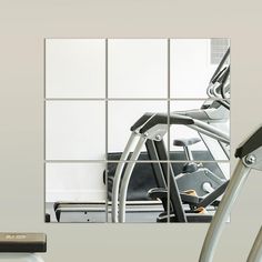 there is a reflection of a gym equipment in the mirror on the wall behind it