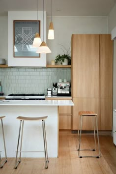 two stools sit in front of the kitchen island