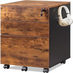 a wooden cabinet with headphones on it's wheels and an earphone attached to the drawer