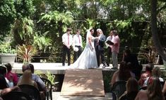 a bride and groom standing at the end of their wedding ceremony