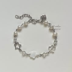 "Handmade Dreamy Pearl Bracelet ✿ Made with freshwater pearls, glass crystal beads,  glass beads, natural shell, and metal accents ✿ Colors: Silver, milky white, iridescent clear, and pearlescent white ✿ The bracelet has an additional 1-1.5\" of extension chain" Chain Bracelet With Beads, Diy Silver Bracelets, How To Make Chain Bracelets, White Metal Pearl Bracelet With Round Beads, Silver Pearl Charm Crystal Bracelet, Silver Crystal Bracelet With Pearl Charm, Handmade Pearl Crystal Bracelet In Silver, White Pearl Charm Bracelets For Jewelry Making, Handmade Silver Pearl Crystal Bracelet